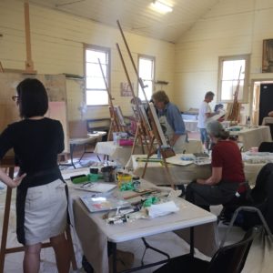 Students painting in the hall