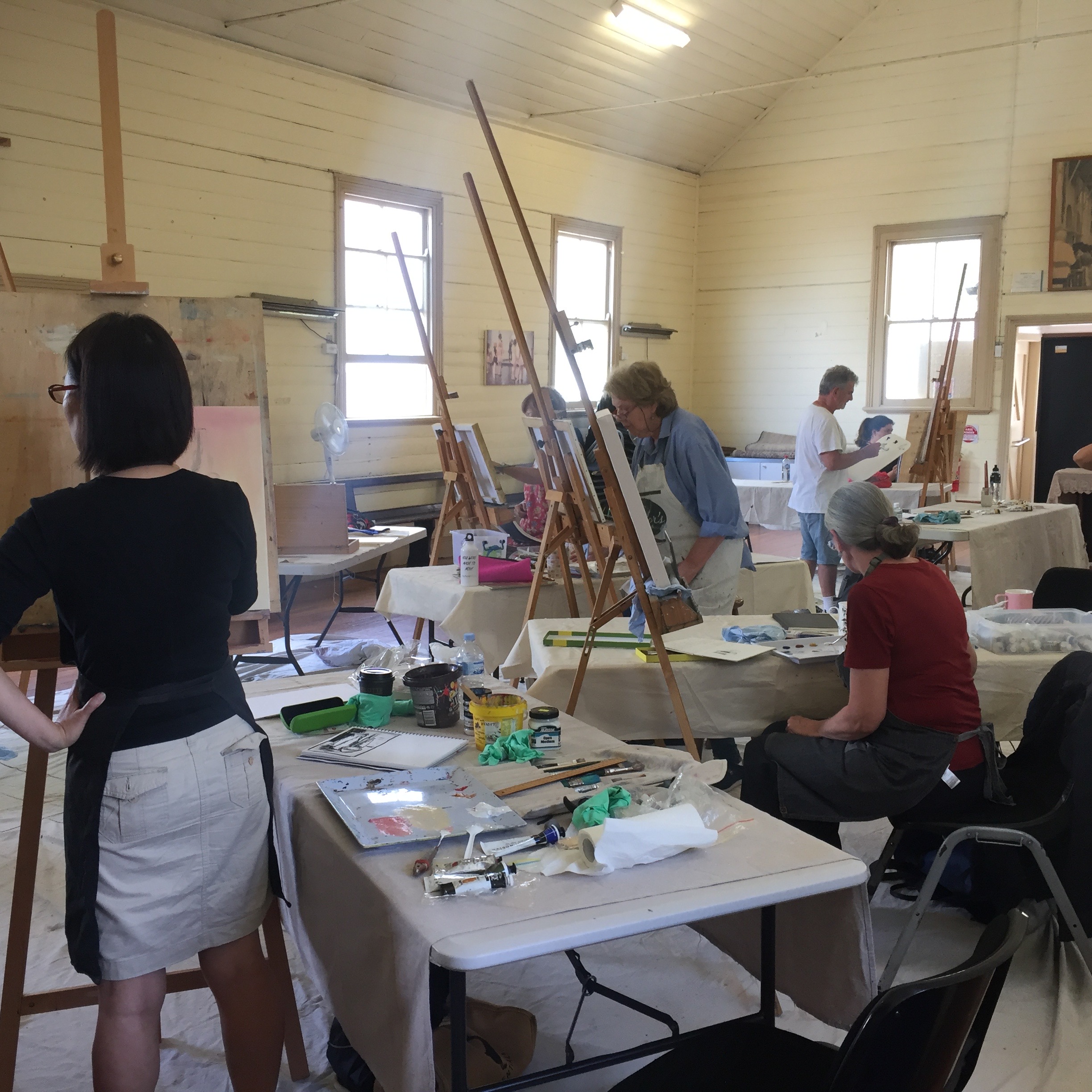 Students painting in the hall